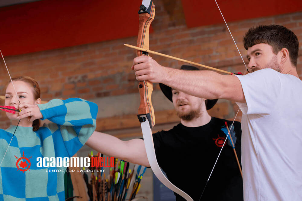 Students learning archery at Academie Duello