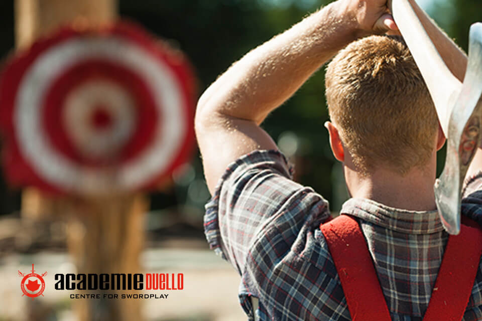 Two-handed axe throwing technique demonstration