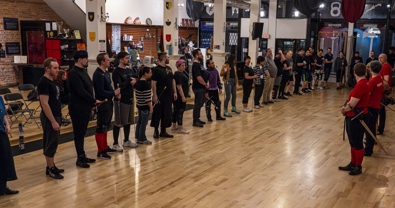 Academie Duello training hall with students lined up
