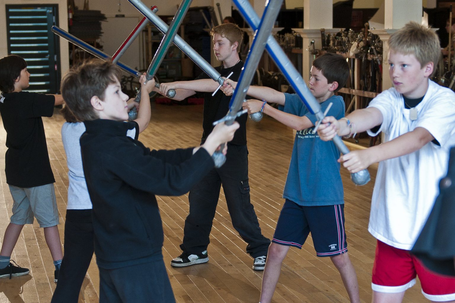 Kids learning sword fighting at Academie Duello